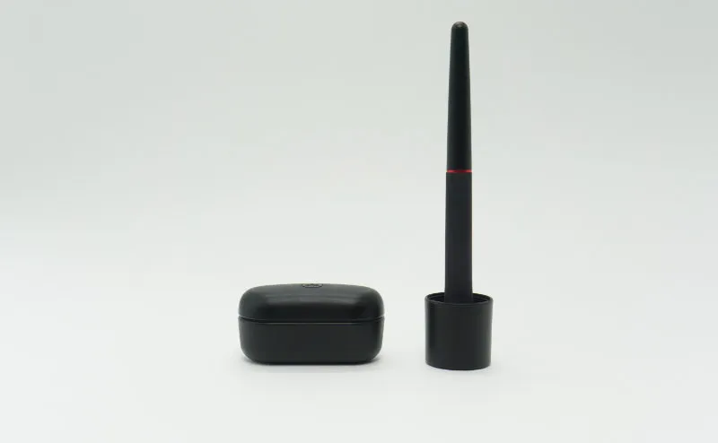 YAMAHA TW-E3A charging case held in a palm for scale
